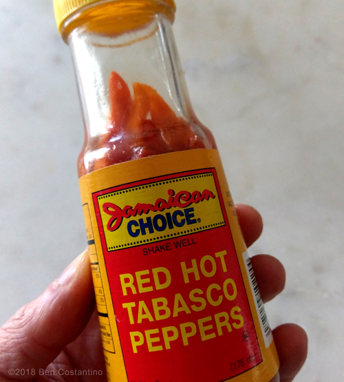 a jar of pickled store-bought Tabasco peppers