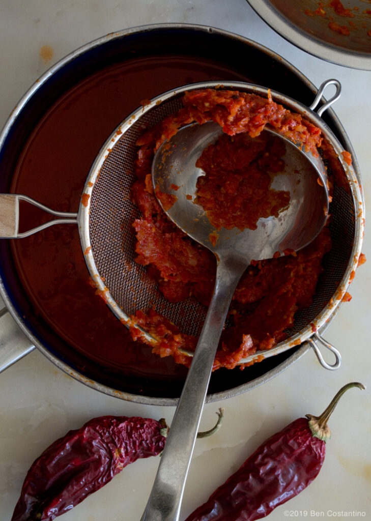 Straining enchilada sauce