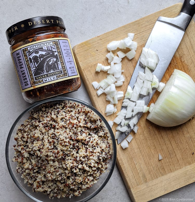 cooked quinoa with salsa and diced onions