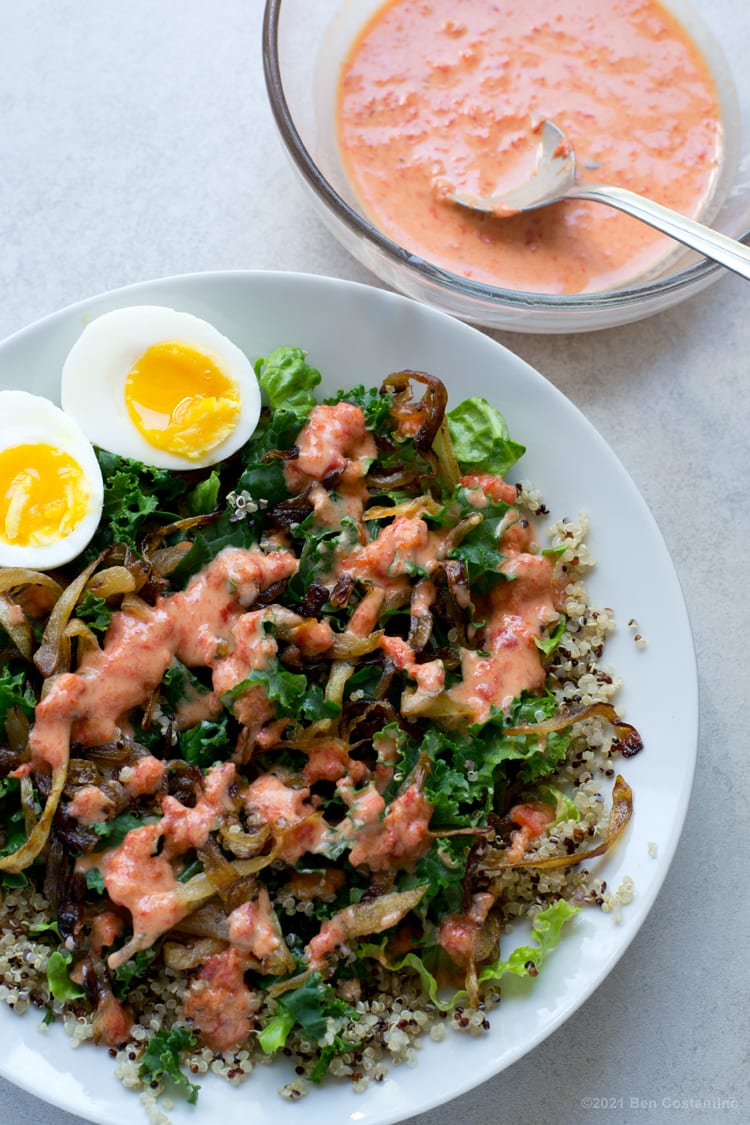 red pepper tahini dressing over a salad