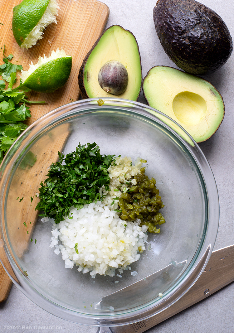 Jalapeño guacamole ingredients in a bowl before they're mixed