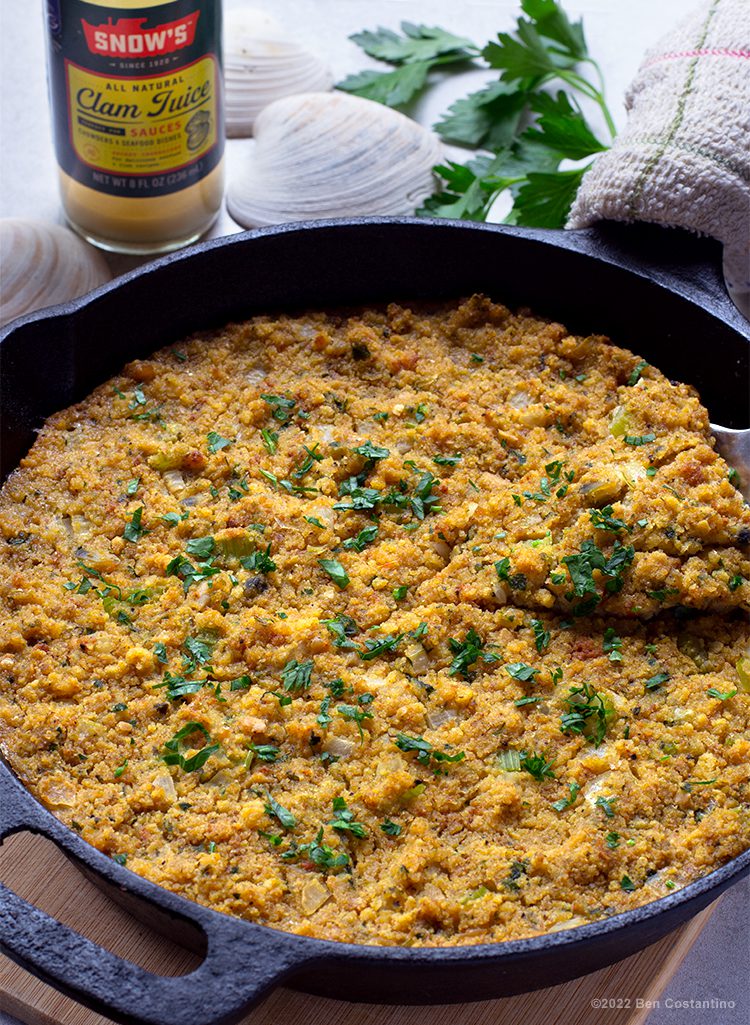 cornbread dressing with clams completed in a cast iron skillet