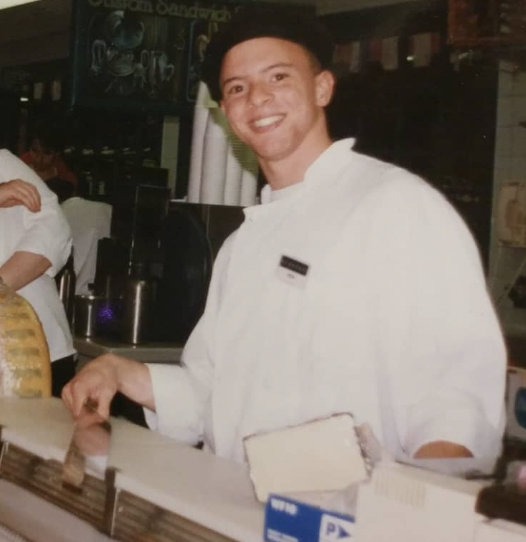 me working as a cheesemonger in college